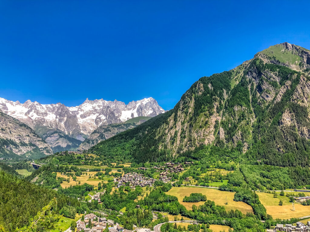 aerial view of small village surrounded by beautiful nature scenes in switzerland